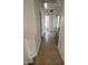 Well-lit hallway features tile floors, leading to other rooms and a built-in counter at 6416 N 78Th Ln, Glendale, AZ 85303