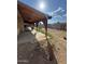 Backyard featuring a covered patio and a block fence, offering a private outdoor space at 6530 W Turney Ave, Phoenix, AZ 85033