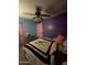 Bedroom with an ornate ceiling fan, and an ensuite closet at 6530 W Turney Ave, Phoenix, AZ 85033