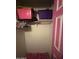 Compact closet with pink door and a shelf at 6530 W Turney Ave, Phoenix, AZ 85033