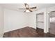 Bedroom featuring wood floors, ceiling fan, and walk-in closet at 6603 W Saddlehorn Rd, Phoenix, AZ 85083