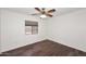 Cozy bedroom with a ceiling fan and window at 6603 W Saddlehorn Rd, Phoenix, AZ 85083