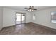 Bedroom with ceiling fan and sliding door to backyard pool area at 6603 W Saddlehorn Rd, Phoenix, AZ 85083