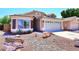 Charming single-story home featuring a well-manicured desert landscape and a two-car garage at 6603 W Saddlehorn Rd, Phoenix, AZ 85083