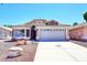 Inviting single-story home with a well-maintained lawn and attached two-car garage at 6603 W Saddlehorn Rd, Phoenix, AZ 85083