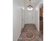 Bright hallway features decorative tile flooring and entry to other rooms at 6603 W Saddlehorn Rd, Phoenix, AZ 85083