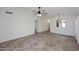 Spacious living room with tile flooring and a ceiling fan, perfect for entertaining at 6603 W Saddlehorn Rd, Phoenix, AZ 85083