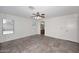 Large main bedroom with ceiling fan, backyard view, and bathroom access at 6603 W Saddlehorn Rd, Phoenix, AZ 85083