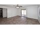 Spacious bedroom with ceiling fan and sliding door to backyard patio at 6603 W Saddlehorn Rd, Phoenix, AZ 85083