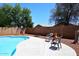 Backyard pool area with spacious patio and privacy fencing provides a relaxing outdoor space at 6603 W Saddlehorn Rd, Phoenix, AZ 85083