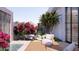 Relaxing backyard with water feature, beautiful landscaping, and outdoor seating for enjoying the serene environment at 6649 E Ocotillo Rd, Paradise Valley, AZ 85253