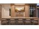 Well-equipped bar with comfortable seating, stylish decor, and an inviting atmosphere for entertaining guests at 6649 E Ocotillo Rd, Paradise Valley, AZ 85253