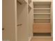 Spacious walk-in closet with built-in shelving and organization system at 6649 E Ocotillo Rd, Paradise Valley, AZ 85253