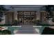 Contemporary entrance with striking water feature and stepping stones creating a dramatic approach to the residence at 6649 E Ocotillo Rd, Paradise Valley, AZ 85253