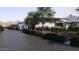 Long driveway with mature landscaping leading to a modern home with clean lines at 6649 E Ocotillo Rd, Paradise Valley, AZ 85253