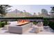 Relaxing outdoor fire pit with stylish seating, perfect for entertaining and enjoying the desert landscape at 6649 E Ocotillo Rd, Paradise Valley, AZ 85253