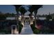 Inviting single-story home with a modern design, landscaped front yard, and illuminated walkway at 6649 E Ocotillo Rd, Paradise Valley, AZ 85253