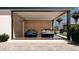 Stylish garage with floor-to-ceiling windows showcasing luxury cars in an organized space at 6649 E Ocotillo Rd, Paradise Valley, AZ 85253