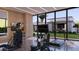 Bright home gym featuring modern exercise equipment and large windows overlooking the landscaped yard at 6649 E Ocotillo Rd, Paradise Valley, AZ 85253