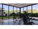 Bright home gym featuring modern exercise equipment and large windows overlooking the green yard at 6649 E Ocotillo Rd, Paradise Valley, AZ 85253