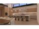 Bright kitchen boasts a waterfall island and sleek wood cabinetry at 6649 E Ocotillo Rd, Paradise Valley, AZ 85253