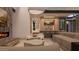 Modern living area featuring a fireplace, a bar area, a comfortable lounge area, and stylish decor at 6649 E Ocotillo Rd, Paradise Valley, AZ 85253