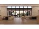 Expansive living room featuring sleek modern furniture and large windows offering abundant natural light at 6649 E Ocotillo Rd, Paradise Valley, AZ 85253