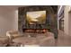 Modern living room features a marble fireplace and lounge seating at 6649 E Ocotillo Rd, Paradise Valley, AZ 85253