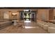 Open-concept living space featuring a central corridor, comfortable seating, and serene outdoor views at 6649 E Ocotillo Rd, Paradise Valley, AZ 85253