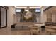 Stylish living room boasting a floor-to-ceiling fireplace, comfortable seating, and chic decor at 6649 E Ocotillo Rd, Paradise Valley, AZ 85253