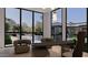 Modern office space featuring a sleek desk, comfortable chairs, and backyard views at 6649 E Ocotillo Rd, Paradise Valley, AZ 85253