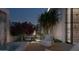 Beautiful outdoor patio featuring a lounge area, elegant water feature, and lush landscaping for relaxation at 6649 E Ocotillo Rd, Paradise Valley, AZ 85253
