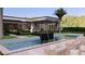 Contemporary pool with water features and ample seating, complemented by sleek architectural design at 6649 E Ocotillo Rd, Paradise Valley, AZ 85253