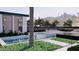 Scenic pool area showcasing water features, comfortable seating, and lush, well-maintained landscaping at 6649 E Ocotillo Rd, Paradise Valley, AZ 85253