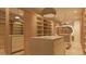 Elegant walk-in closet with custom shelving, center islands, and mirrored doors, blending luxury and functionality at 6649 E Ocotillo Rd, Paradise Valley, AZ 85253
