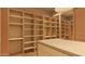 Organized walk-in closet with custom shelving, drawers, and accent lighting, maximizing storage efficiency at 6649 E Ocotillo Rd, Paradise Valley, AZ 85253
