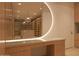 Well-lit walk-in closet featuring custom shelving, vanity area, and spacious layout, creating a sophisticated retreat at 6649 E Ocotillo Rd, Paradise Valley, AZ 85253