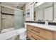 Inviting bathroom boasting a stylish vanity, modern fixtures, and a glass enclosed shower at 703 E Corte Oro --, Phoenix, AZ 85020