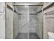 Beautiful shower with mosaic glass doors and tile accents, complete with an overhead shower fixture at 703 E Corte Oro --, Phoenix, AZ 85020