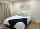 Comfortable bedroom featuring a bed with stylish linens, curtains and decorative wall art at 703 E Corte Oro --, Phoenix, AZ 85020