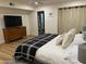 Bright bedroom with stylish furnishings, including a sleek dresser and comfortable bed with modern decor at 703 E Corte Oro --, Phoenix, AZ 85020