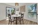 Dining room with modern light fixture and sliding glass doors offers a bright and airy dining space at 703 E Corte Oro --, Phoenix, AZ 85020