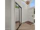Bright entryway with wood flooring, chandelier, mirror closet doors, and large arch window at 703 E Corte Oro --, Phoenix, AZ 85020