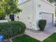 Home exterior featuring desert landscaping, a two-car garage, and warm toned stucco at 703 E Corte Oro --, Phoenix, AZ 85020