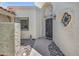 Inviting front entrance with decorative accents, iron gate, and attractive landscaping create charming curb appeal at 703 E Corte Oro --, Phoenix, AZ 85020