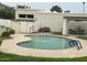 Community pool area featuring a well-maintained pool, lounge seating and lush greenery at 703 E Corte Oro --, Phoenix, AZ 85020