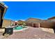 Bird's eye view of backyard pool featuring rock accents, palm trees, and a shady pergola nearby at 723 S Weaver Dr, Apache Junction, AZ 85120