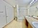 Bright bathroom featuring a double sink vanity, shower over tub, and toilet at 723 S Weaver Dr, Apache Junction, AZ 85120