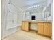 Bright bathroom with a double sink vanity, bathtub, and a shower head at 723 S Weaver Dr, Apache Junction, AZ 85120