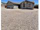 Inviting single-story home with a two-car garage and low maintenance desert landscaping at 723 S Weaver Dr, Apache Junction, AZ 85120